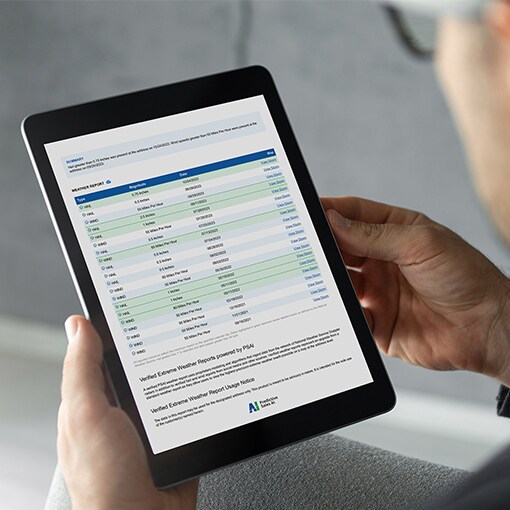 Roofing contractor viewing QuickSite report on tablet