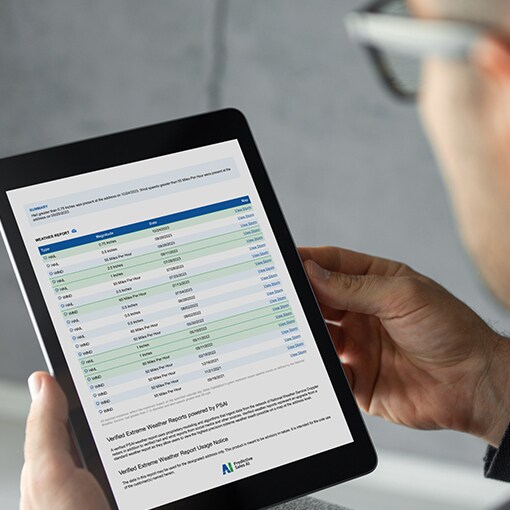 Roofing contractor viewing QuickSite report on tablet
