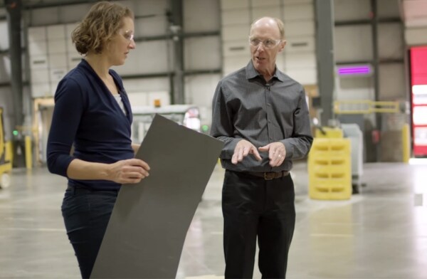 GAF business and roofing science architects discussing designs in a warehouse