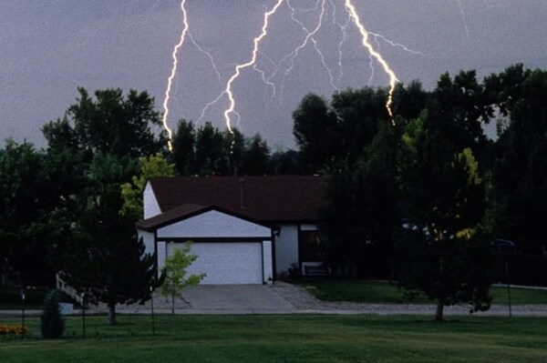 Lightning strike close to a house